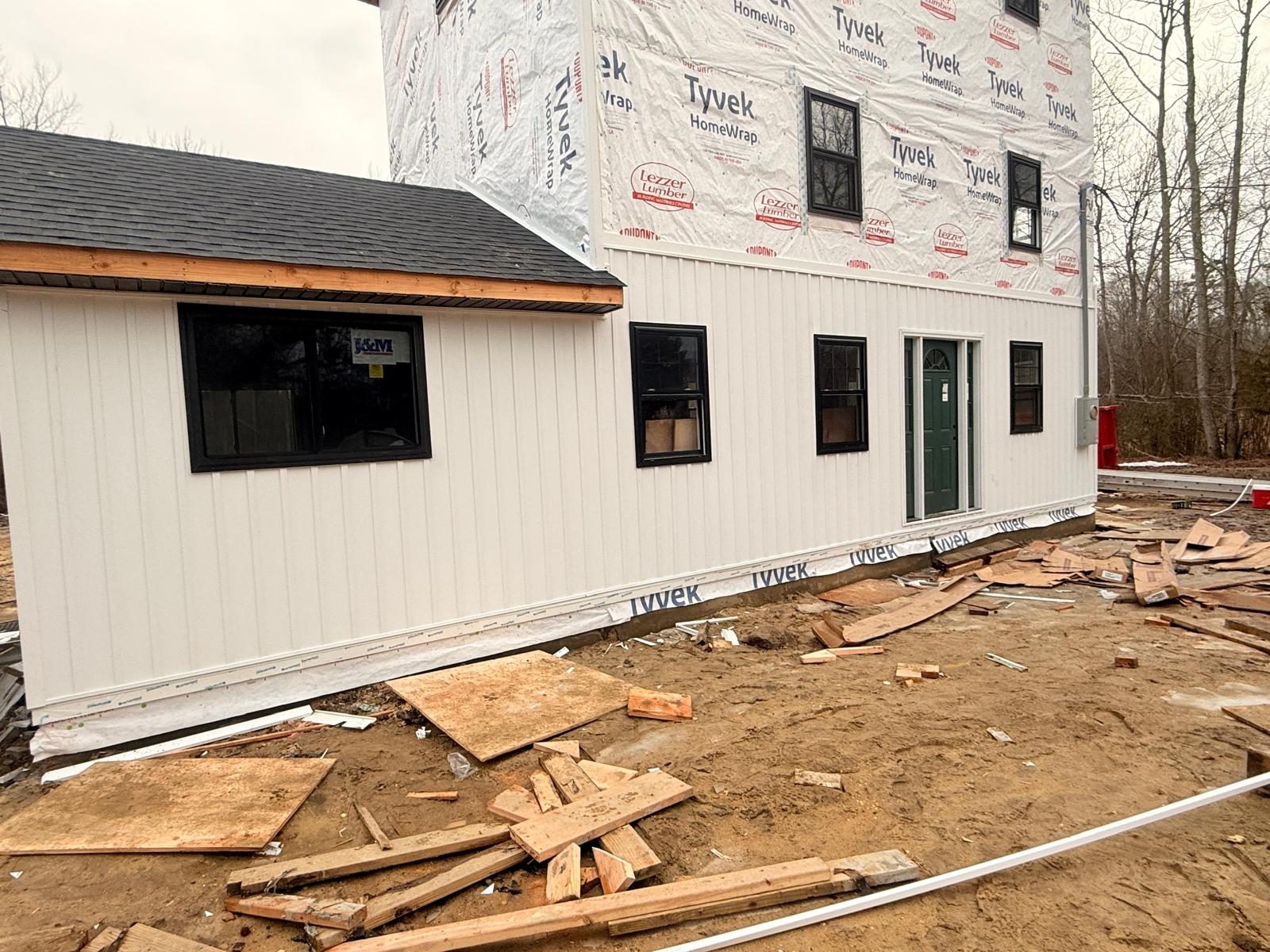 winter siding damage Tri State Area homes cracked vinyl siding panel from winter freeze thaw damage